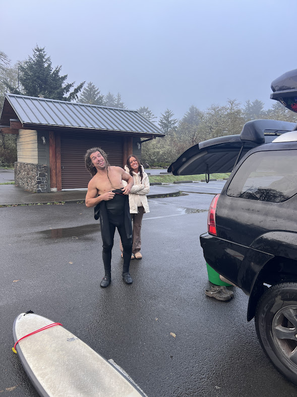 KC struggling to put on wetsuit